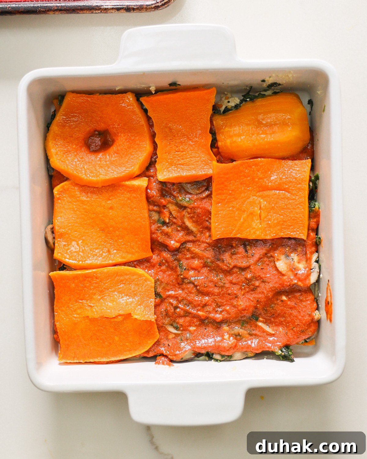 layering butternut squash lasagna 