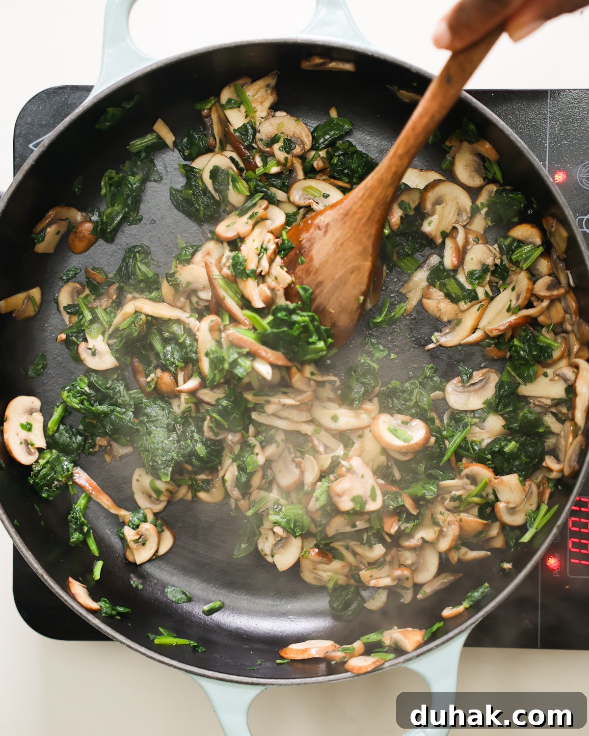 sautéing mushrooms and spinach