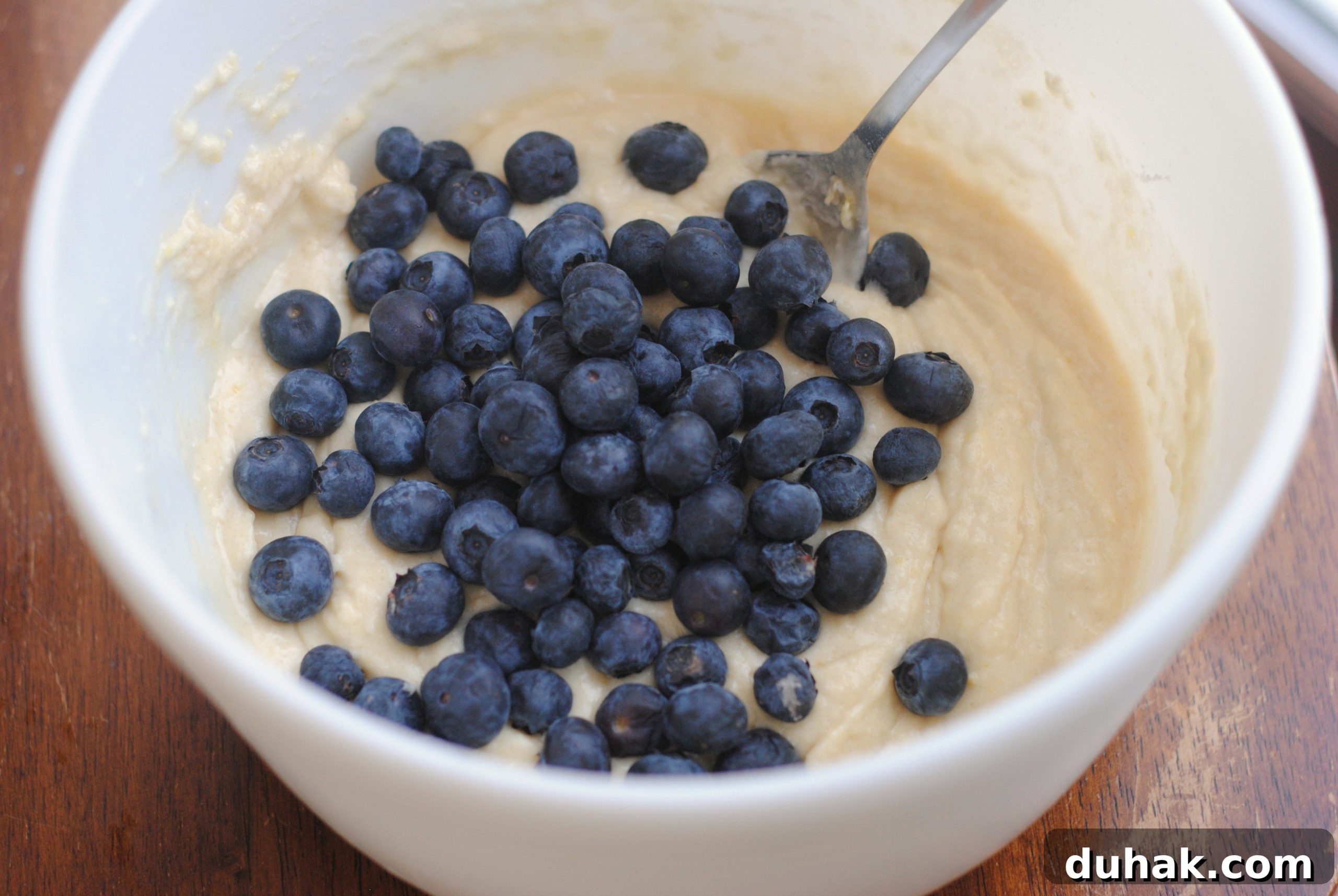 Fluffy Blueberry Muffins with Crunchy Walnuts 6 Blueberry Walnut Muffins batter in a bowl