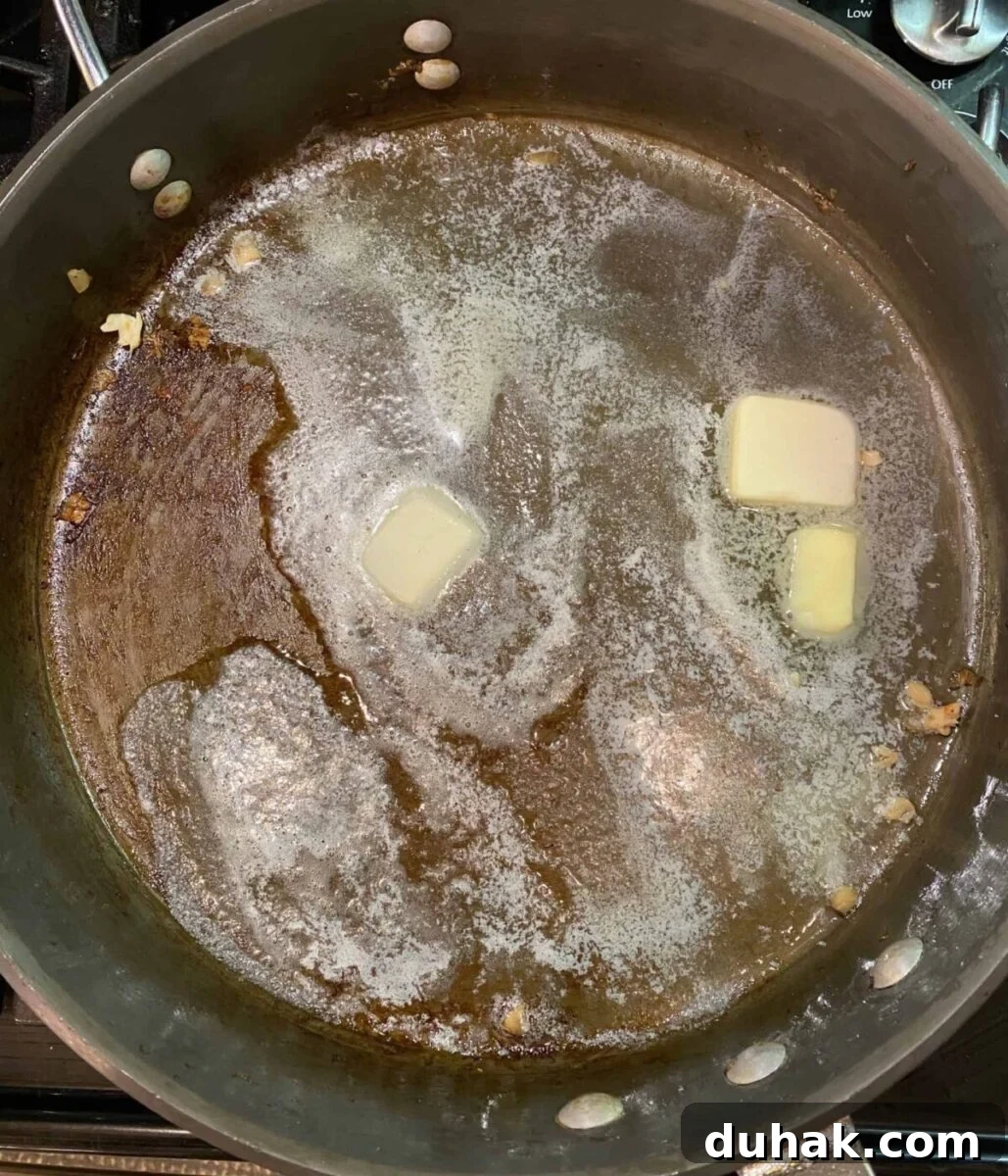 Creamy Spicy Alfredo Sauce Recipe for Pasta and Wings 8 Butter melting in a hot skillet on the stove.