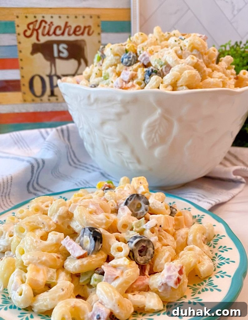 Creamy Summer Pasta Salad in a serving bowl and on a plate.