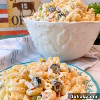 Creamy Summer Pasta Salad in a serving bowl and on a plate.