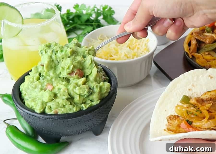 Authentic Homemade Guacamole Recipe — Simple & Flavorful 6 authentic guacamole being served on a taco
