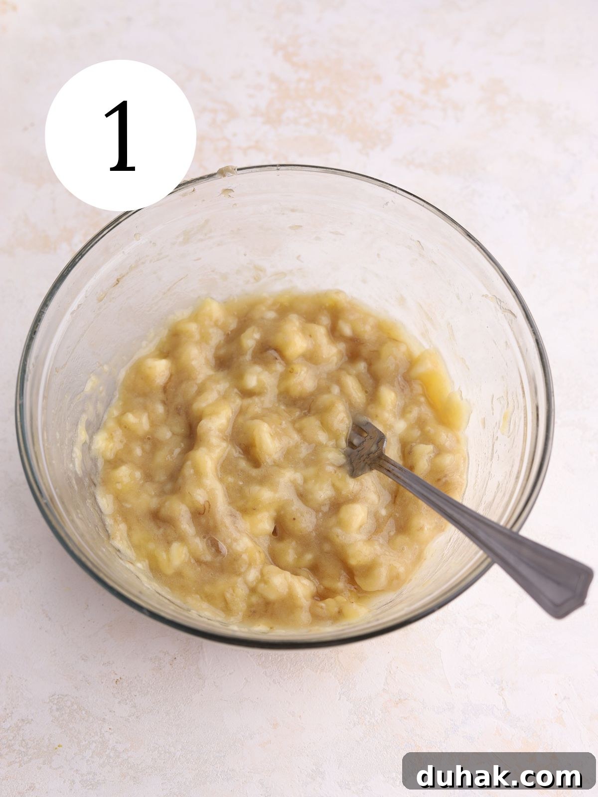 Moist Banana Spice Cake Recipe with Warm Cinnamon Flavor 5 Mashed bananas in a mixing bowl