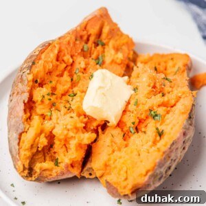 How to Cook a Sweet Potato in the Microwave Fast 10 An overhead image of microwaved sweet potatoes on a plate with a tablespoon of butter on top.