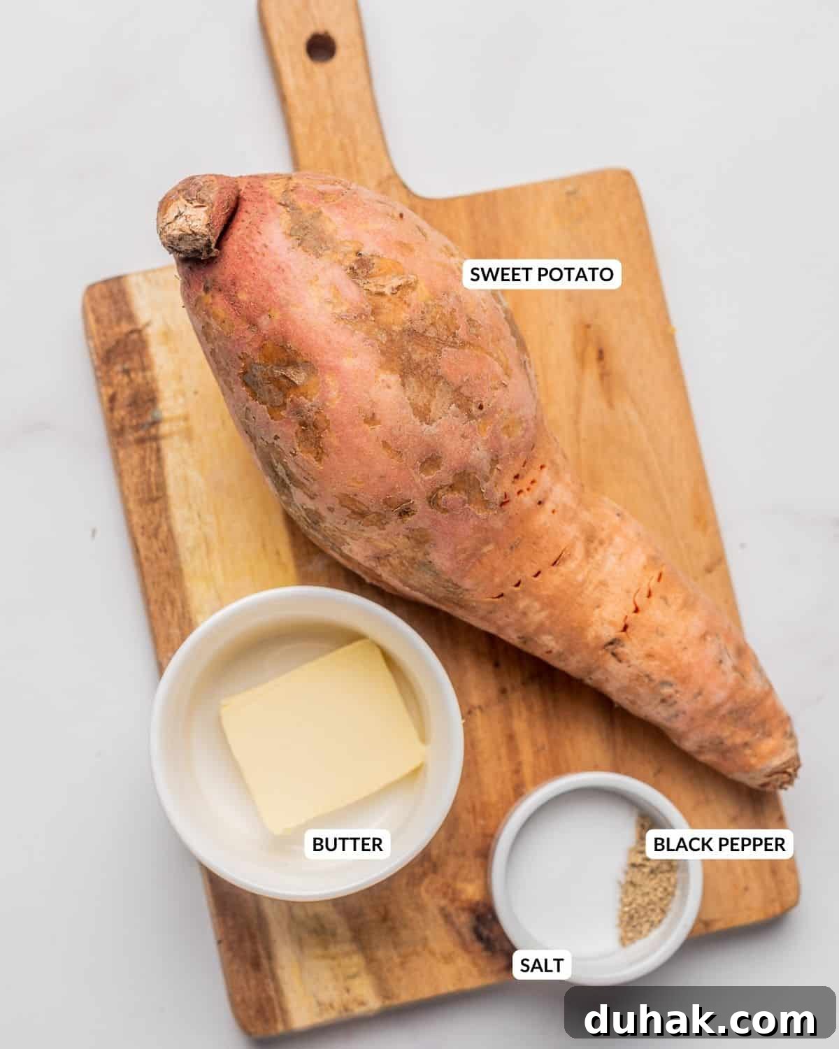 How to Cook a Sweet Potato in the Microwave Fast 3 An overhead image of each ingredient of microwave sweet potato, with labels.