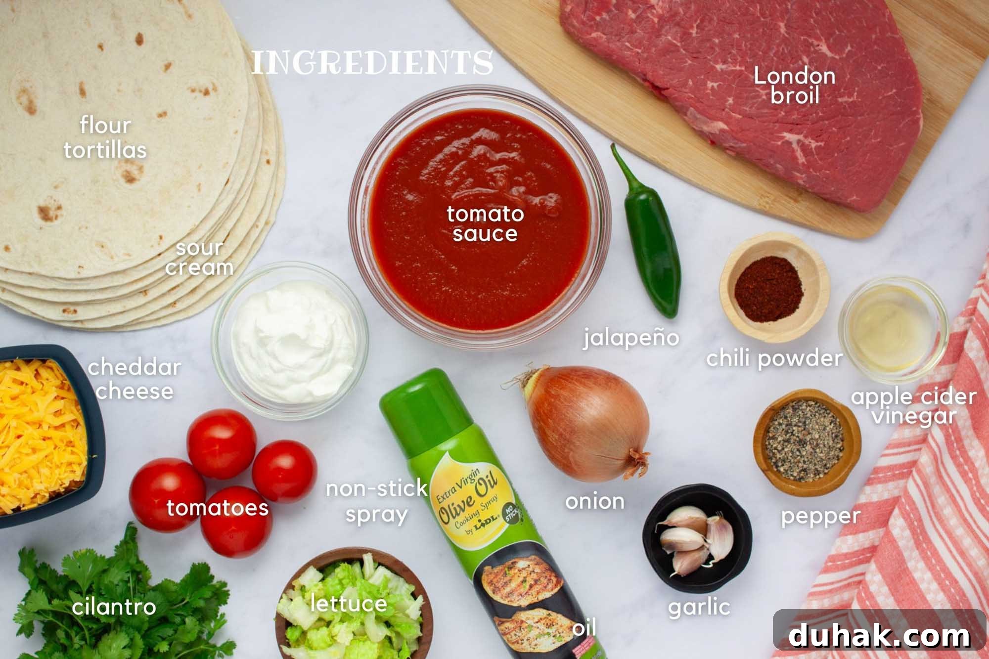 Slow-Cooked Seasoned Beef Burritos for the Crockpot 3 Ingredients for beef burritos: flour tortillas, tomato sauce, jalapeño, cheddar cheese, sour cream, tomatoes, cilantro, lettuce, onion, garlic, pepper, chili powder, apple cider vinegar, London Broil, and non-stick spray.