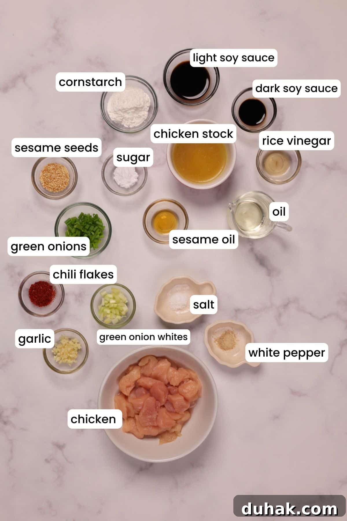 Garlic Chicken Stir-Fry with Spicy Szechuan Sauce 3 Ingredients for making Chinese garlic chicken on a white background.