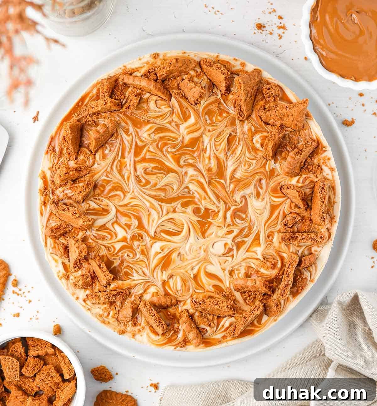 Cheesecake seen from above on a white plate.