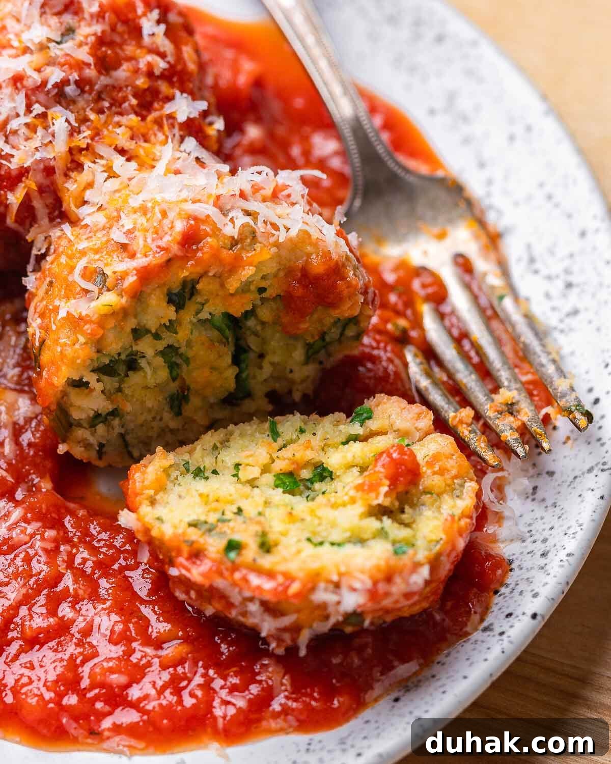 White plate of cut open polpette di pane.