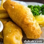 Battered white fish on parchment paper