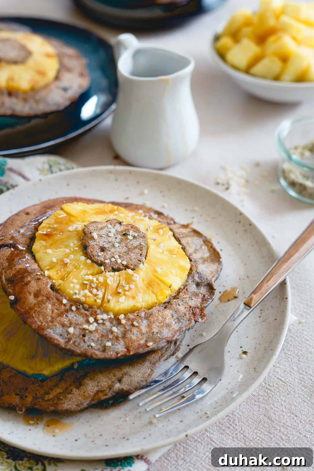 These pineapple buckwheat pancakes are studded with hemp seeds and whole rings of fresh pineapple. They're the perfect balance between hearty and sweet.