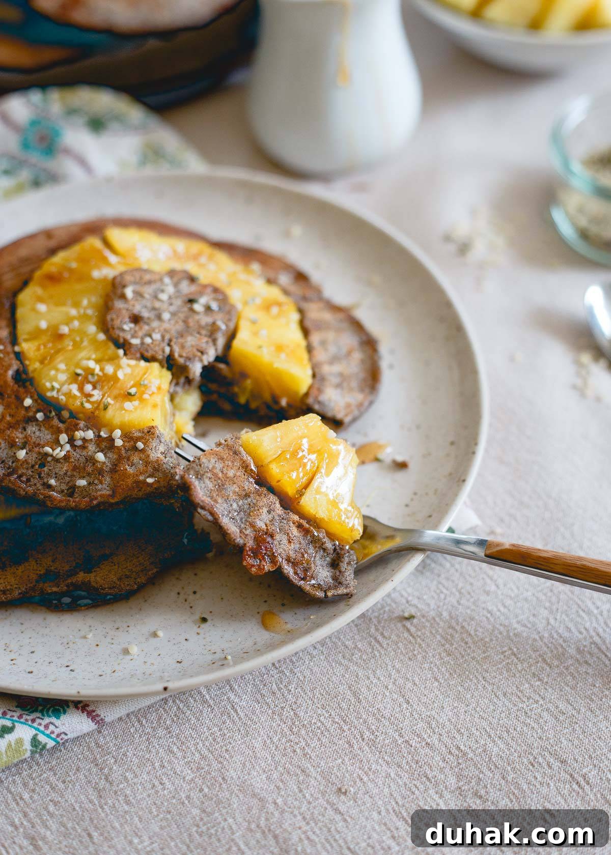 Kick off breakfast with a stack of these pineapple buckwheat pancakes studded with nutritious hemp seeds.
