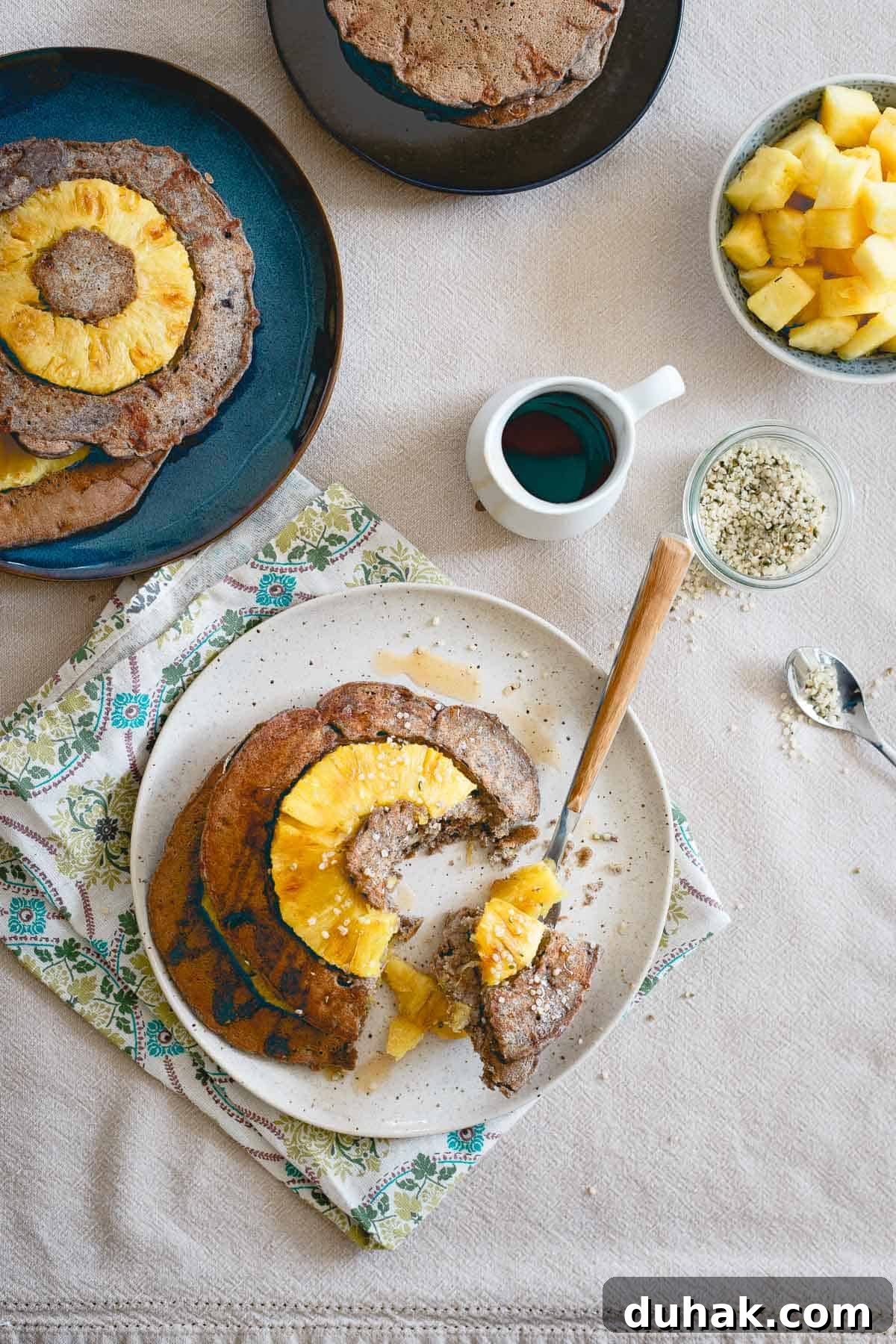 With a drizzle of maple syrup and a fresh pineapple ring in each one, these hearty buckwheat pancakes are a well balanced start to the day.