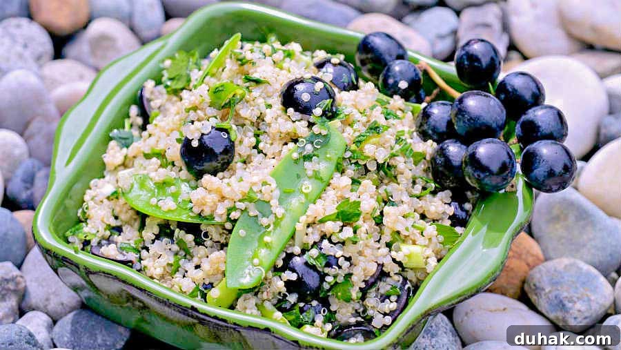 quinoa salad with grapes and sweet peas i a bowl