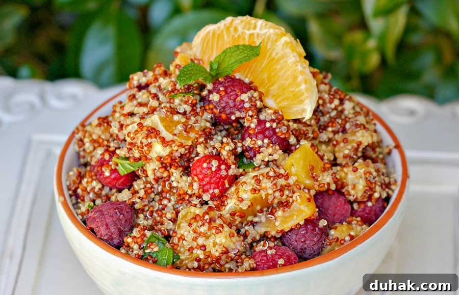 summer quinoa fruit salad with oranges in a bowl