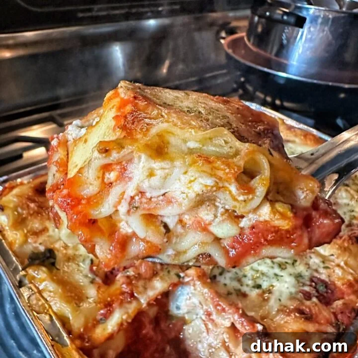 A slice of Classic Lasagna being lifted out of the dish