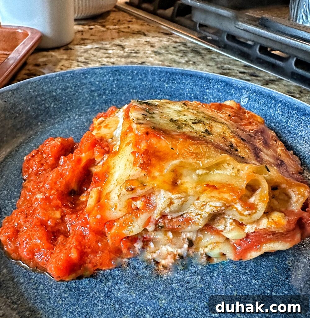 Authentic Italian Lasagna Recipe for Rich, Homemade Flavor 15 A piece of lasagna on a blue plate