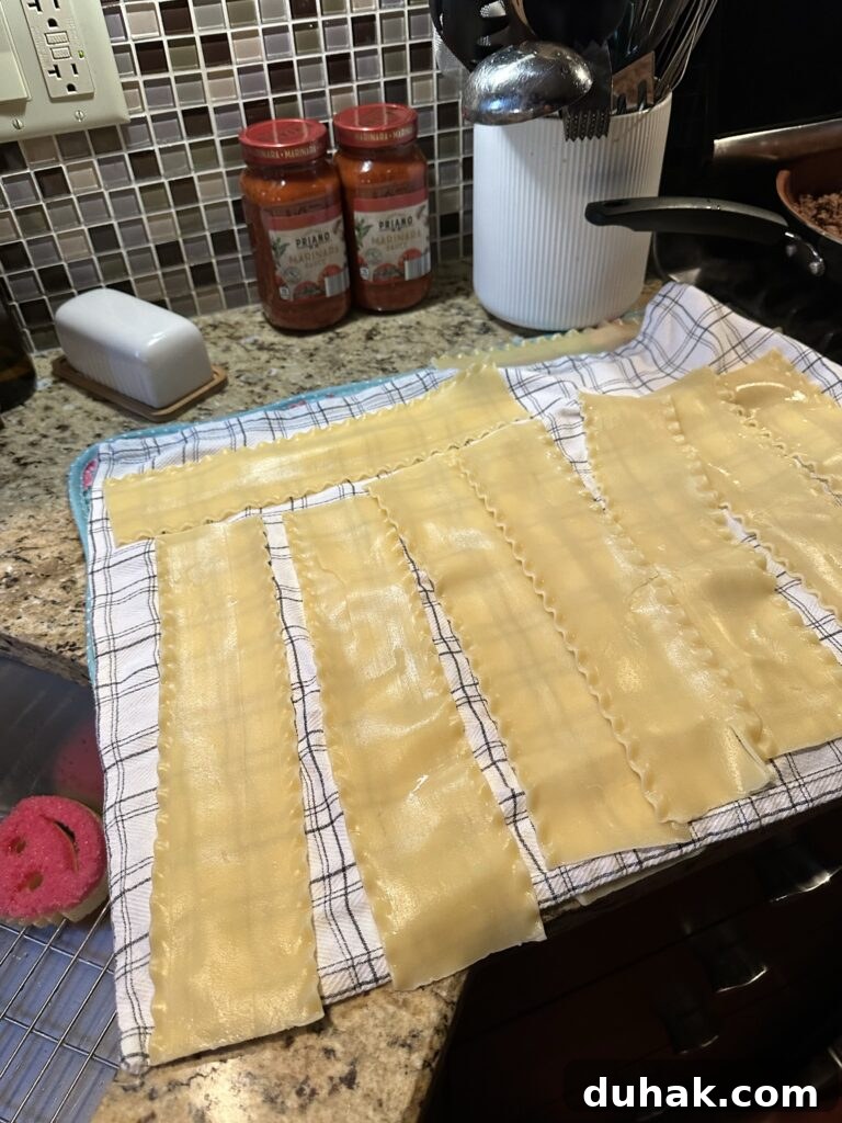 Authentic Italian Lasagna Recipe for Rich, Homemade Flavor 4 Lasagna noodles laid out on a kitchen towel