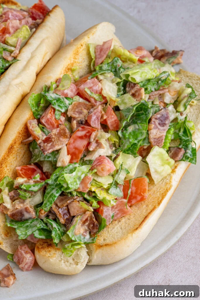 Close up of a chopped BLT sandwich on a serving platter.