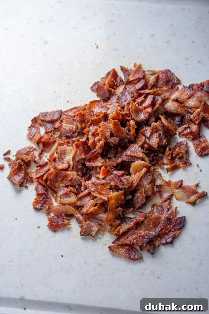 Chopped bacon on a cutting board.