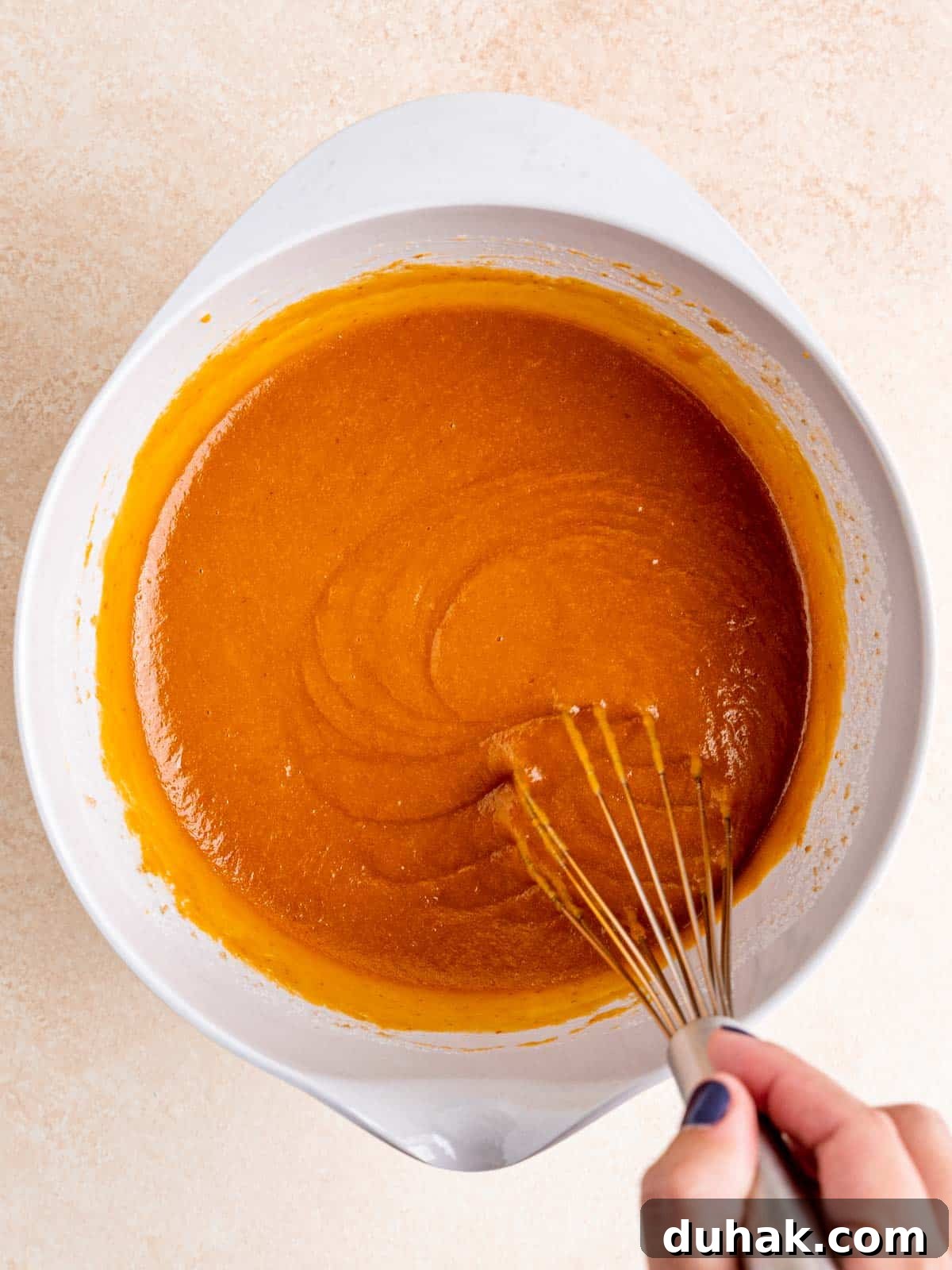 Pumpkin Snickerdoodle Quick Bread Recipe for Fall Baking 5 Whisking wet ingredients in a bowl.