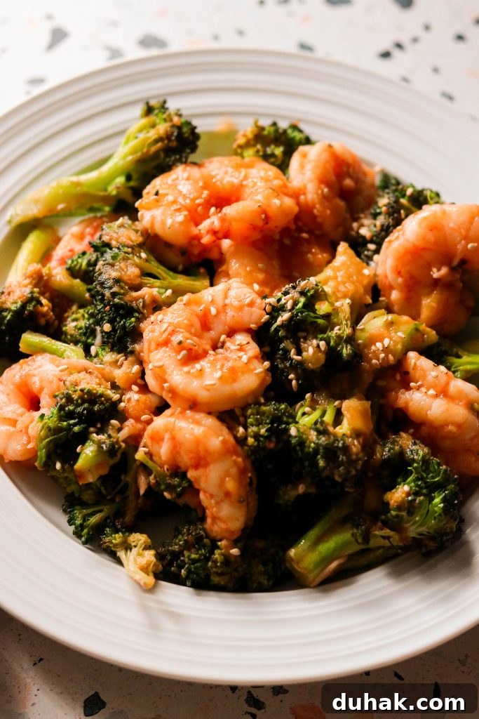 Whole30 and Paleo Sweet and Sour Shrimp with Broccoli — Sheet Pan Meal 6 sweet and sour shrimp with broccoli on a plate