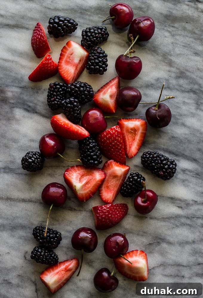 Coconut Cake with Blackberry-Coconut Whipped Cream and Mixed Berries