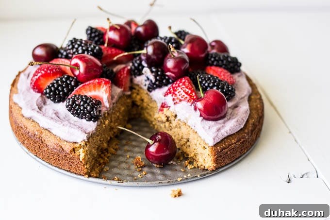 Coconut Cake with Blackberry-Coconut Whipped Cream and Mixed Berries