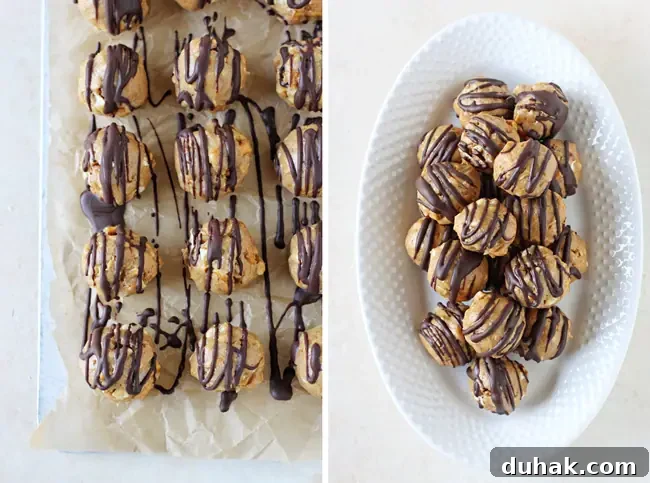 Peanut Butter Pretzel Balls on a baking sheet, plus more on a white serving platter.