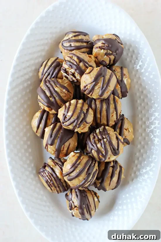 A white serving platter filled with Peanut Butter Pretzel Bites.