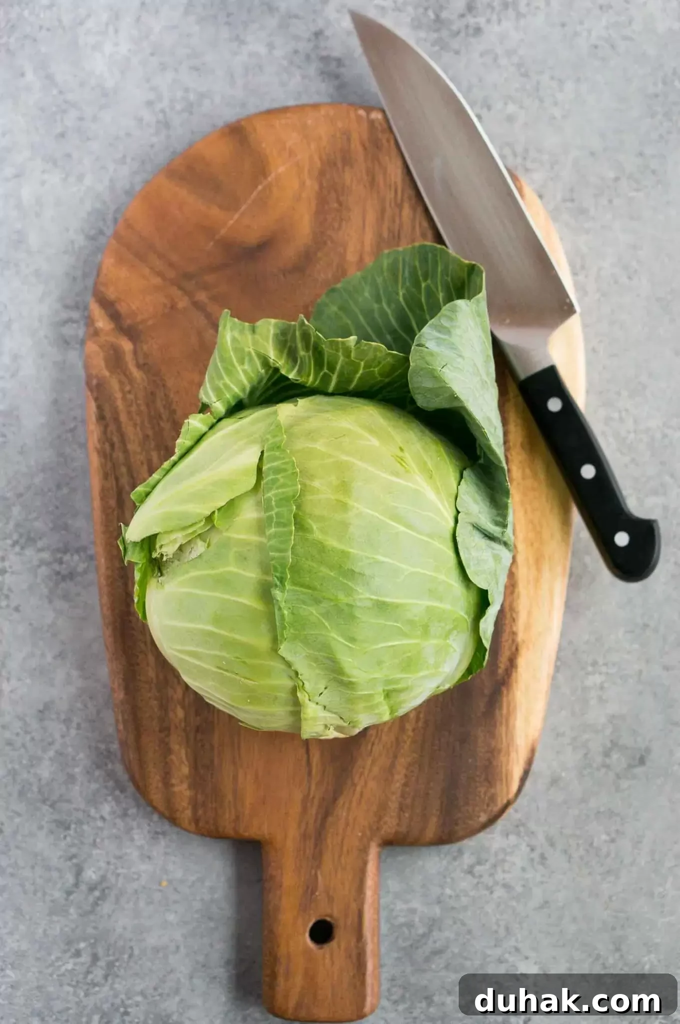 How to Cut Cabbage Like a Pro: Step-by-Step Guide 3 cabbage on a wooden cutting board