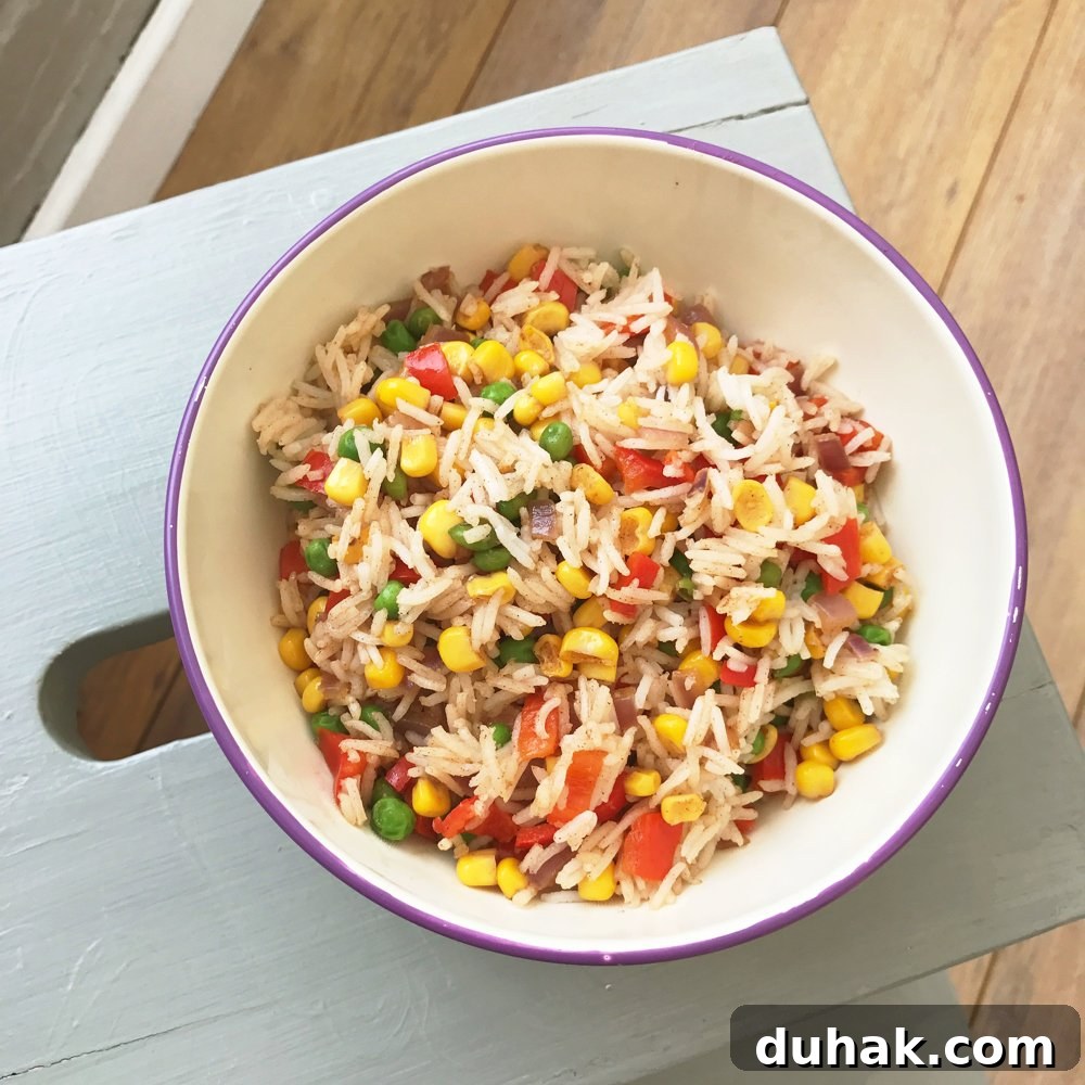 grey painted wooden IKEA footstool with white and purple enamel bowl on top filled with homemade veggie rice salad