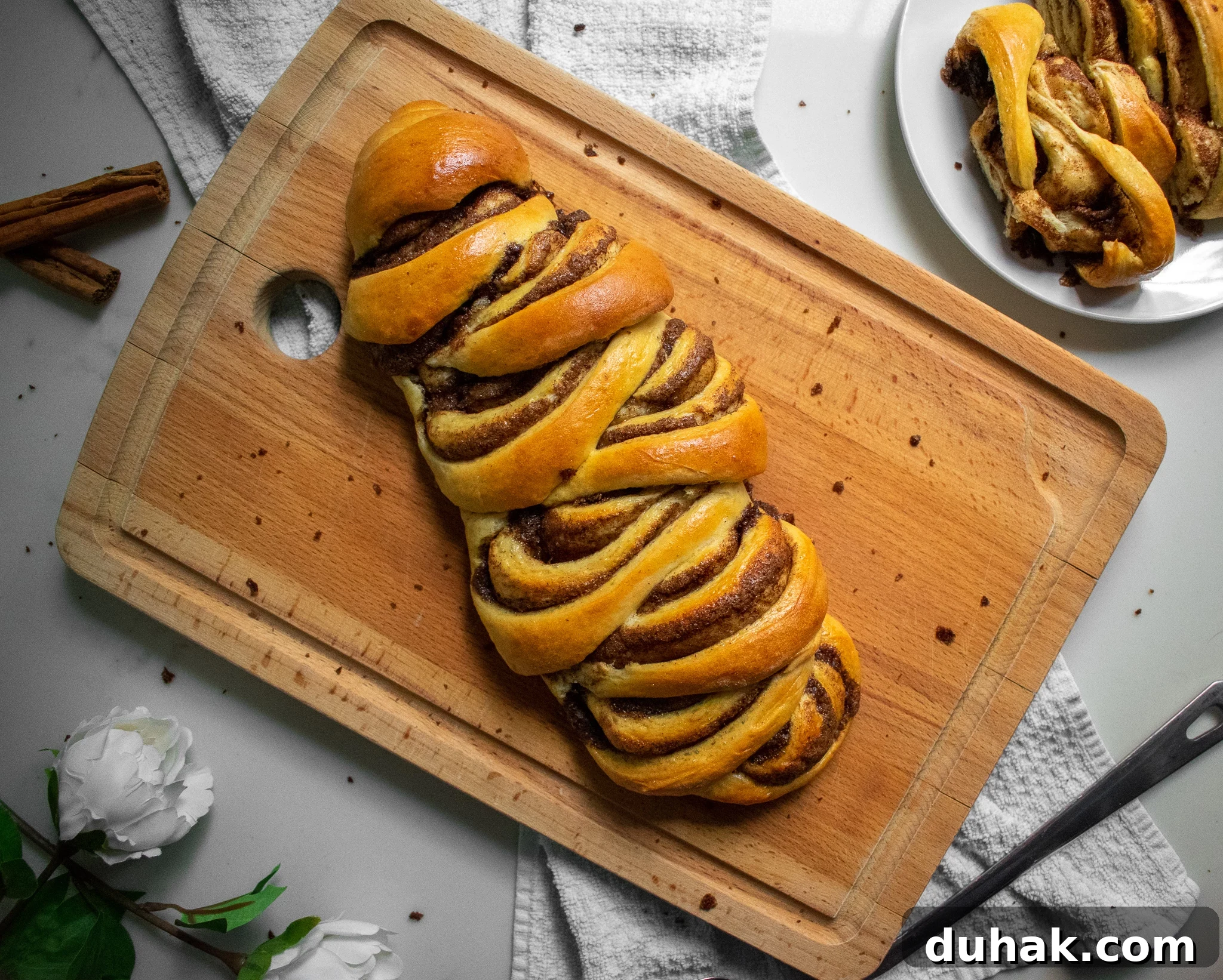 Cinnamon roll loaf on a cutting board.