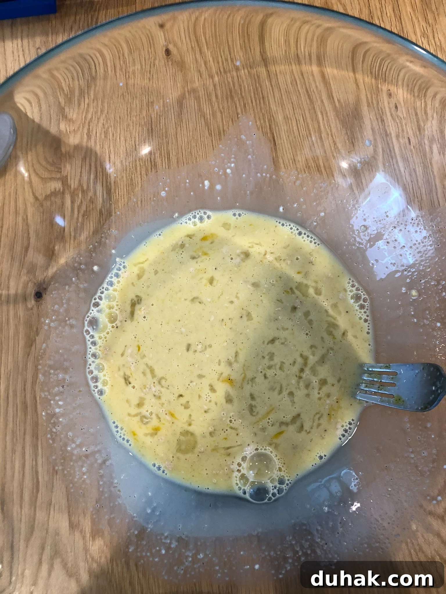 Ingredients being mixed in a bowl.