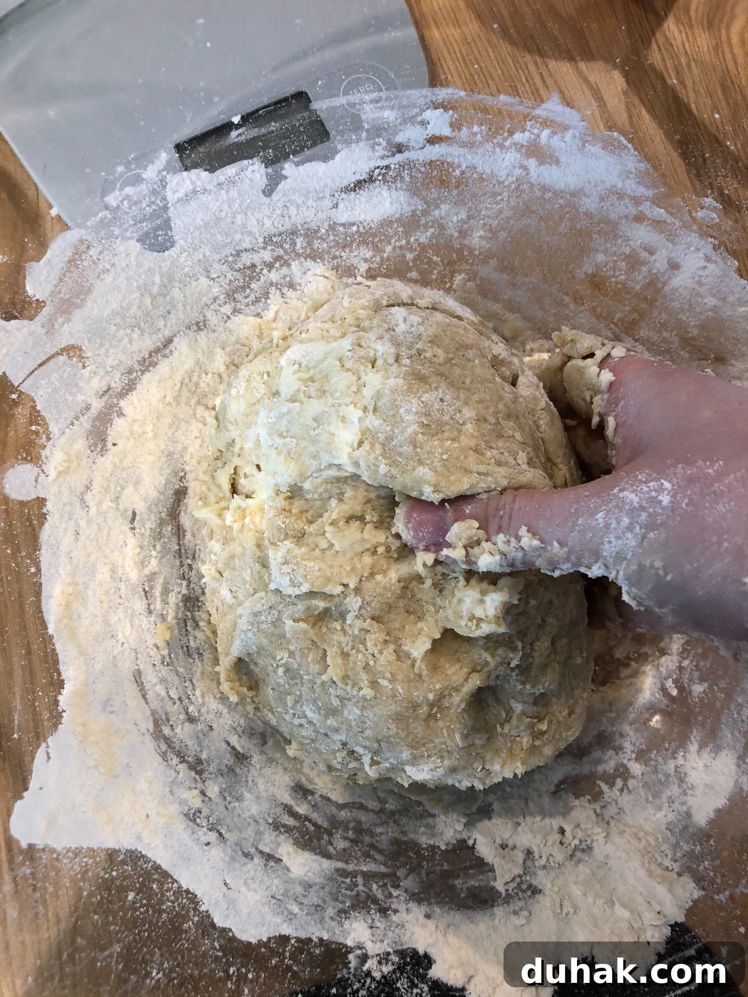 Mixing dough in a bowl.