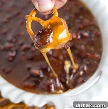 pretzel dipped in maple bacon sugar cookie dip