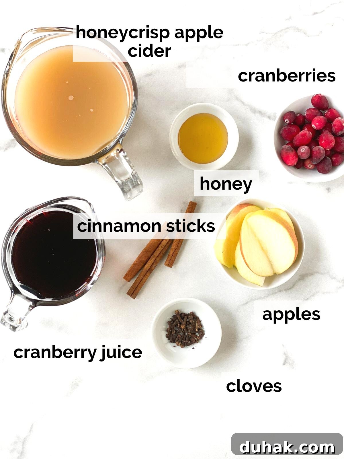Alcohol-Free Wassail Recipe: Festive Mulled Apple Punch 3 Ingredients for wassail on a table.
