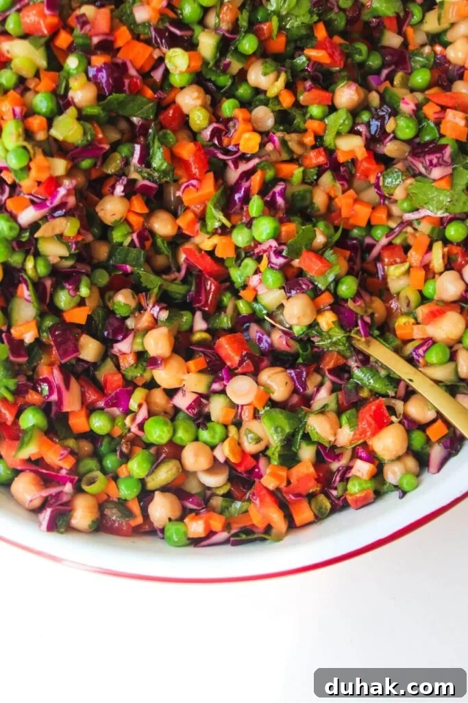 Close up of rainbow chopped salad in a large bowl.