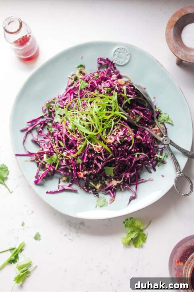 Crunchy Asian salad on a large light blue serving plate.