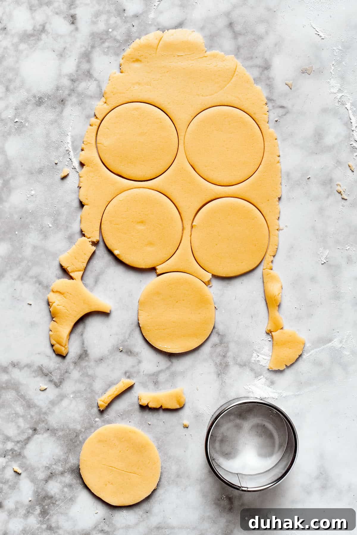 Sugar cookie dough cut into rounds.