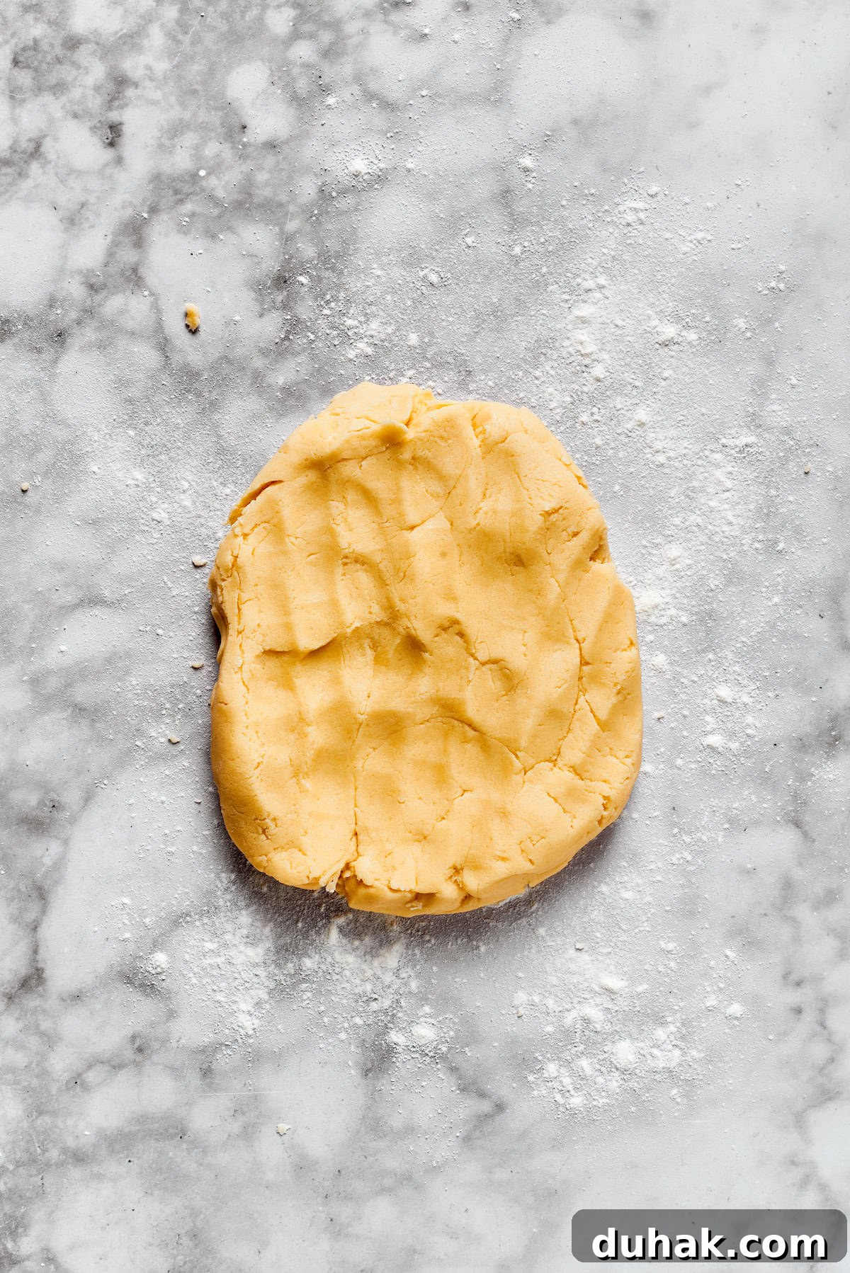 Sugar cookie dough on a counter.
