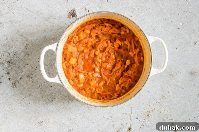 Chakalaka: Traditional South African Spicy Vegetable Relish (Vegan, Gluten-Free) 8 final overhead shot of chakalaka in a white pot with handles