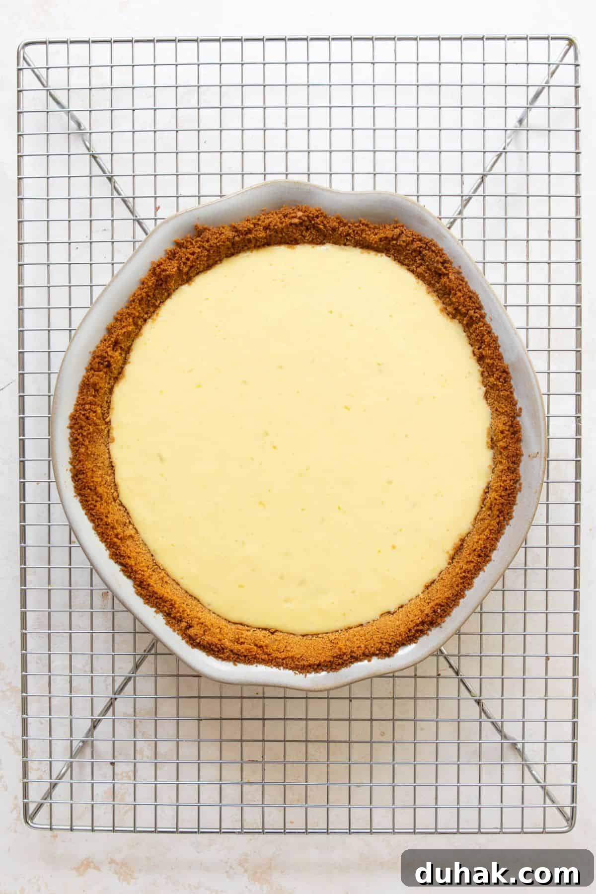 Key Lime Pie (Gluten-Free) — Zesty Citrus Dessert Recipe 11 Baked gluten-free key lime pie cooling on a wire rack.
