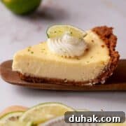 Key Lime Pie (Gluten-Free) — Zesty Citrus Dessert Recipe 18 Slice of gluten-free key lime pie with a buttery graham cracker crust, topped with whipped cream and a lime wedge.