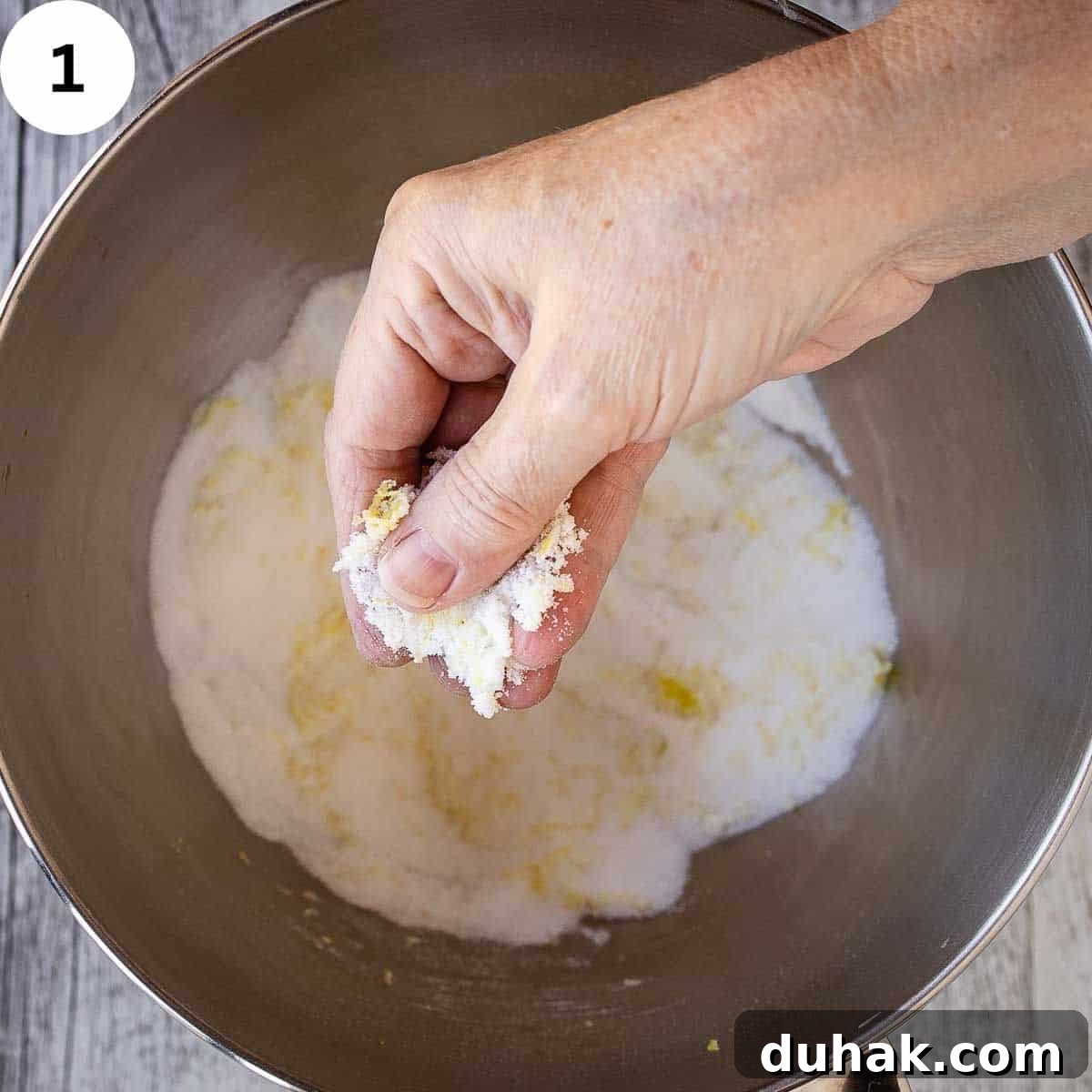 Lemon Ricotta Cookies Recipe — Soft, Zesty Citrus Cookies 4 Rubbing lemon zest into white sugar.