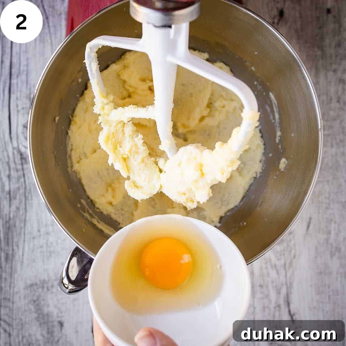 Lemon Ricotta Cookies Recipe — Soft, Zesty Citrus Cookies 5 Adding an egg to creamed butter and sugar.