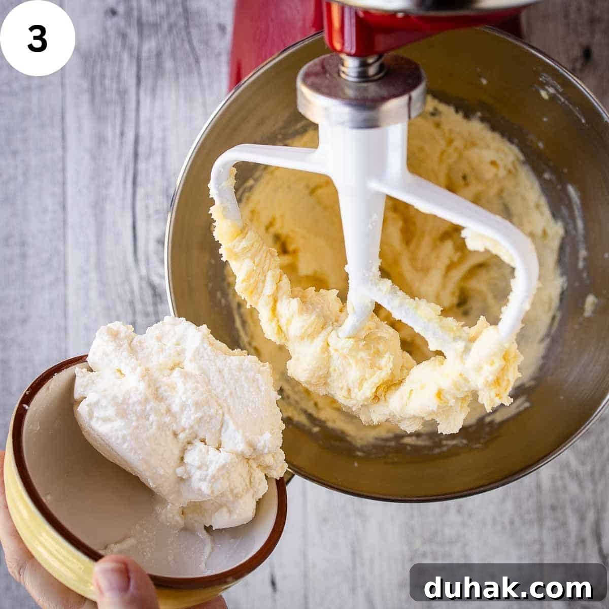 Lemon Ricotta Cookies Recipe — Soft, Zesty Citrus Cookies 6 Adding ricotta cheese to creamy mixture in a stand mixer.