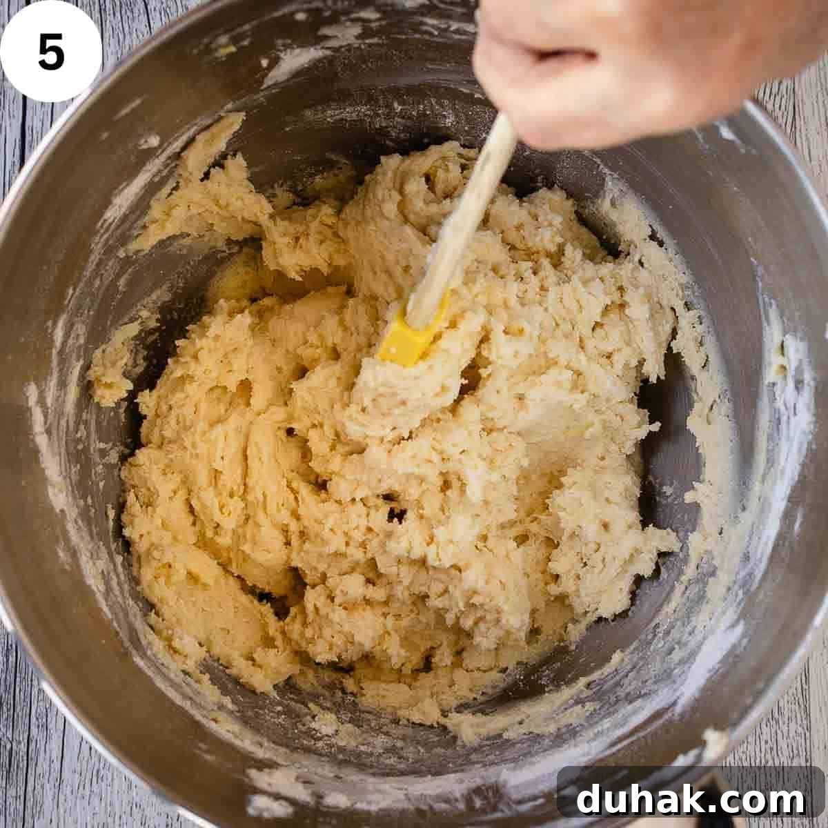 Lemon Ricotta Cookies Recipe — Soft, Zesty Citrus Cookies 8 Stirring soft cookie dough in a stainless steel bowl.