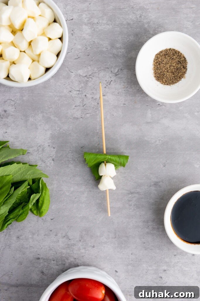 Caprese Skewers Recipe: Cherry Tomato, Mozzarella & Basil Bites 5 mozzarella and basil on skewer